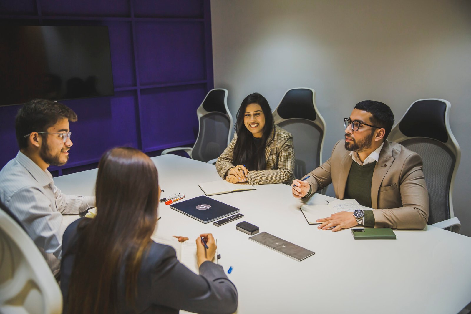 RepStack team members meeting around a conference table.